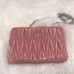 Pre-owned Miumiu clutch. Well maintained. Pink.